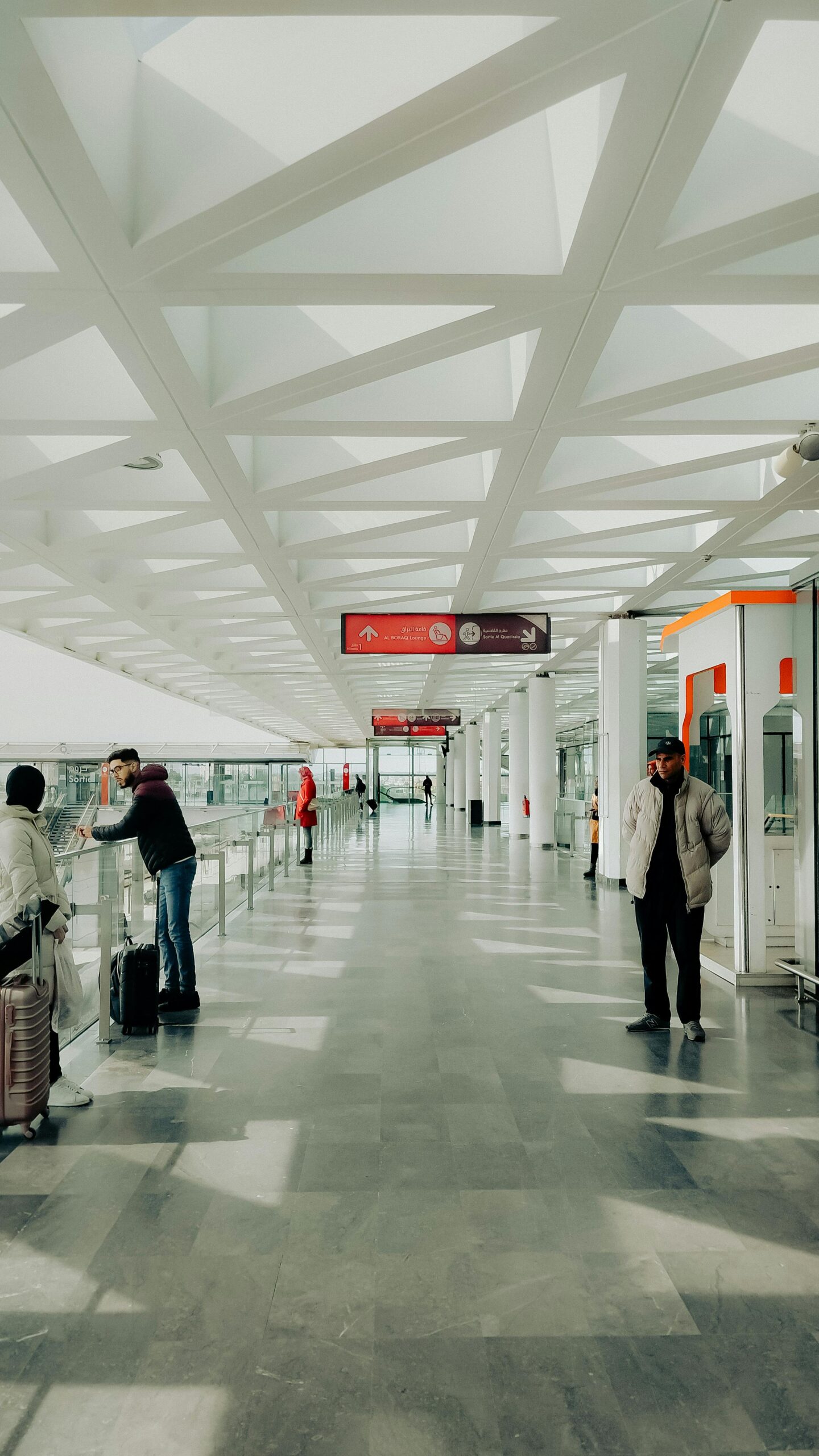 airport morocco rabat People in a sleek modern airport terminal in Rabat, capturing travel and urban design.